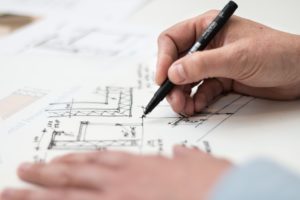 a person sketching a design